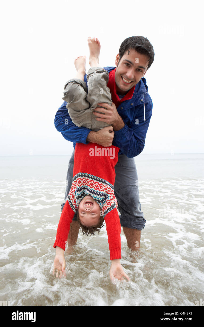 Happy father with son on beach Stock Photo
