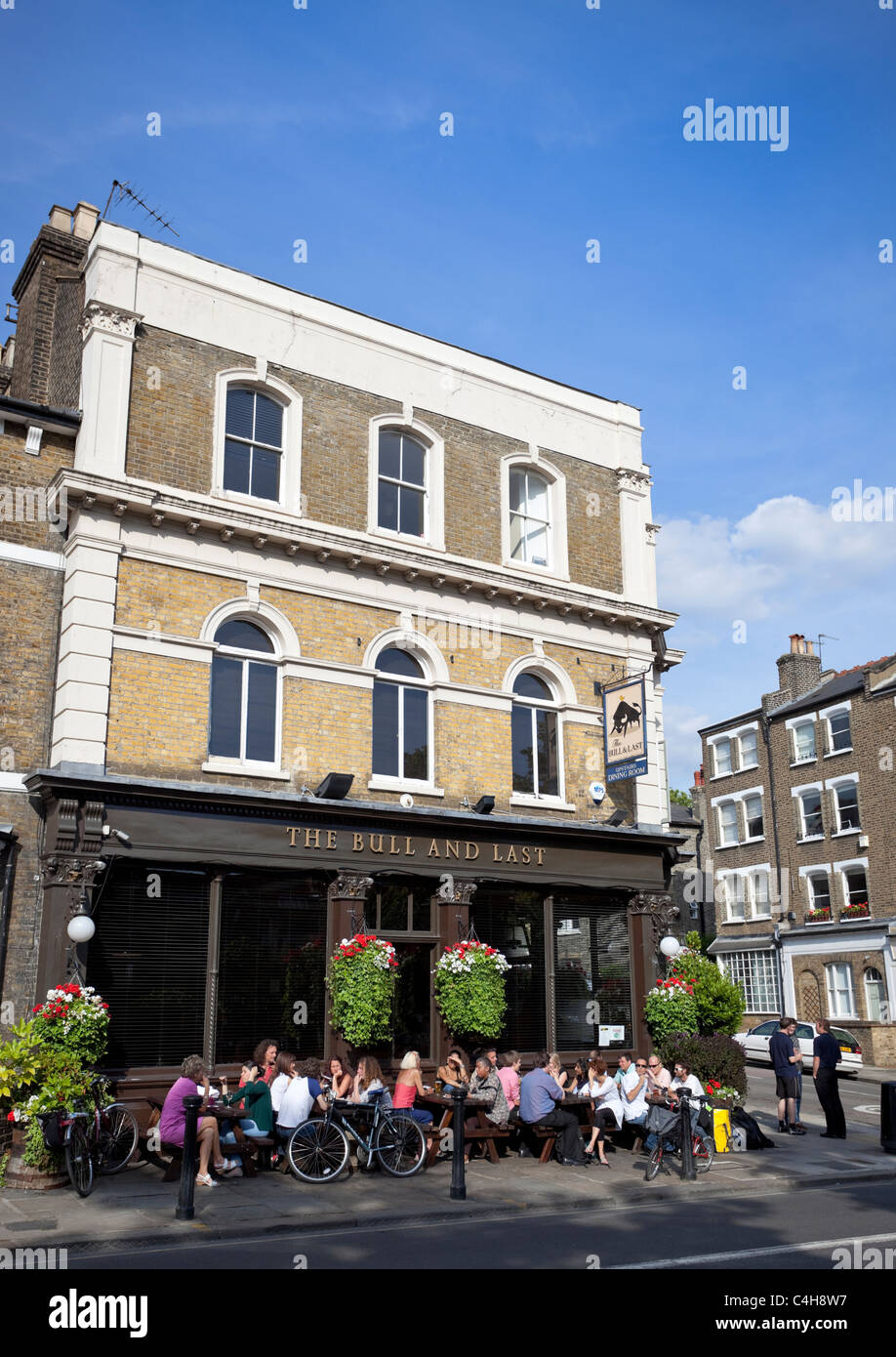 People enjoying summer at a pub terrace, Highgate Road, London, UK Stock Photo