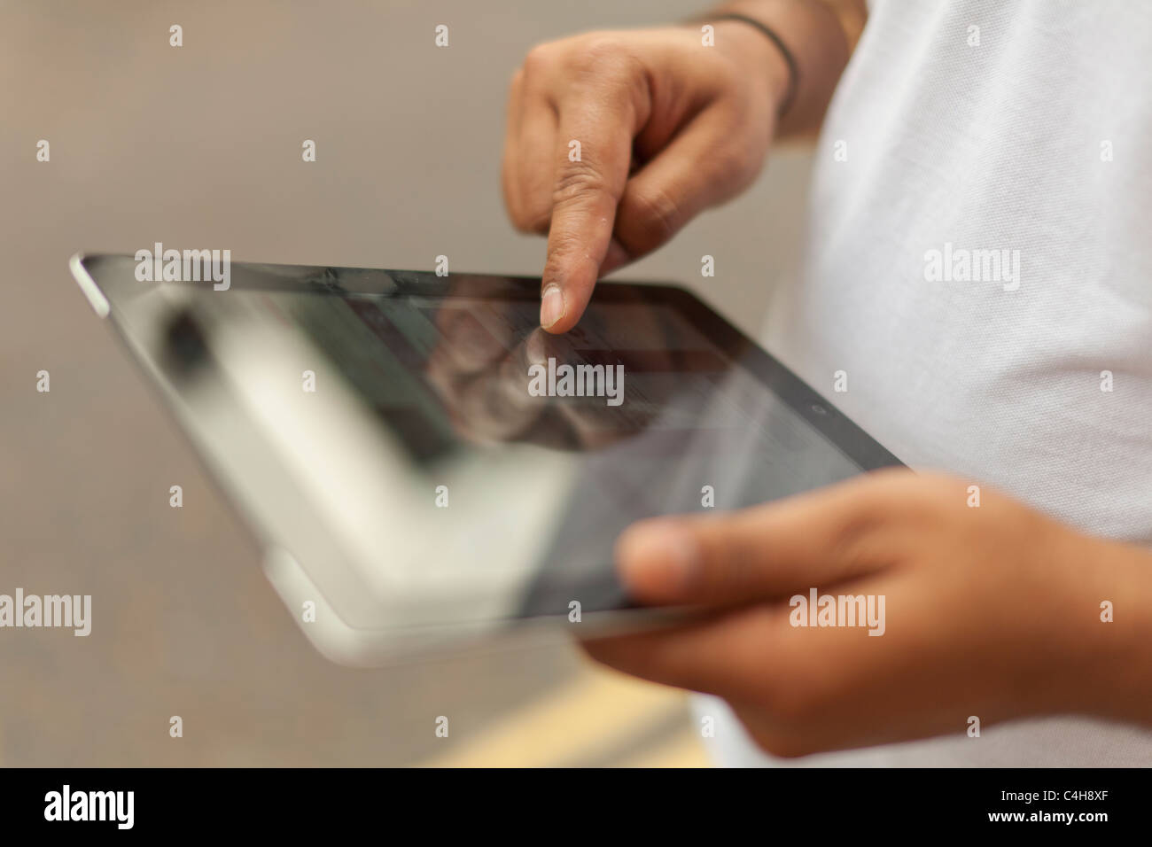 Person  using an I pad 2 device-Close-up Stock Photo