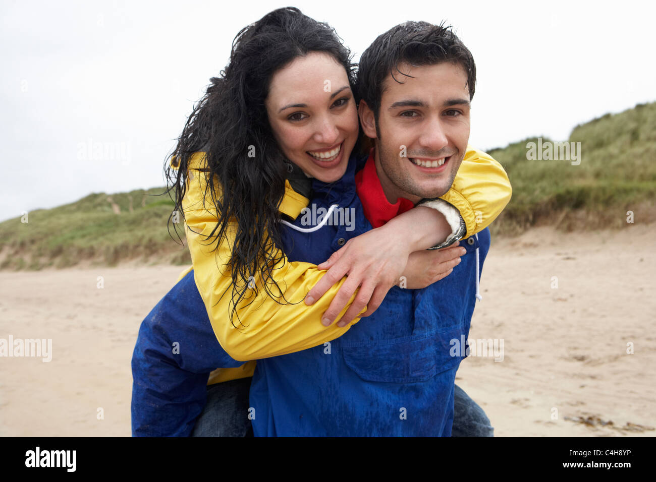Happy couple on beach in love Stock Photo