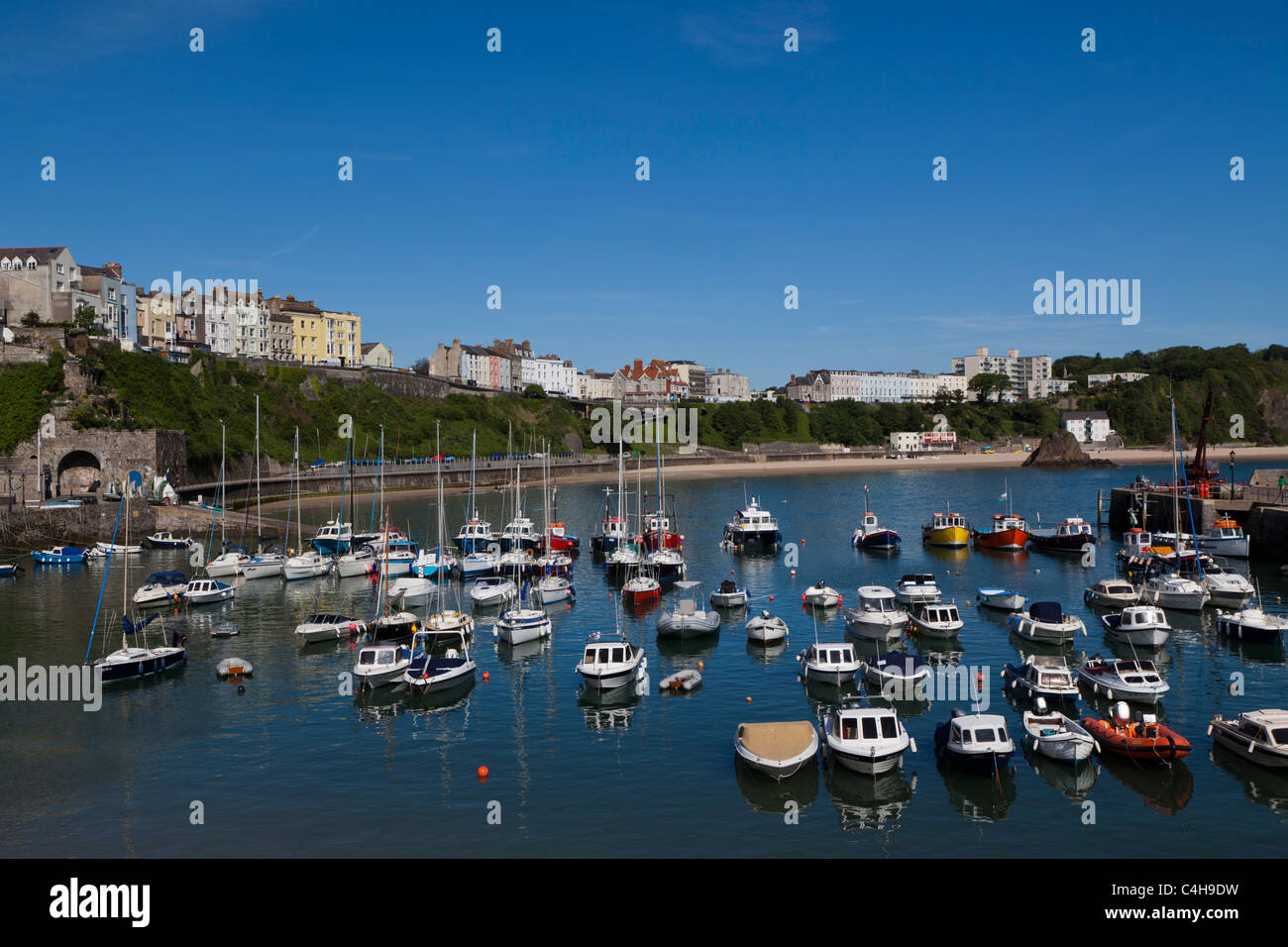 Tenby Harbour at hight tide with boats moored in rows Stock Photo