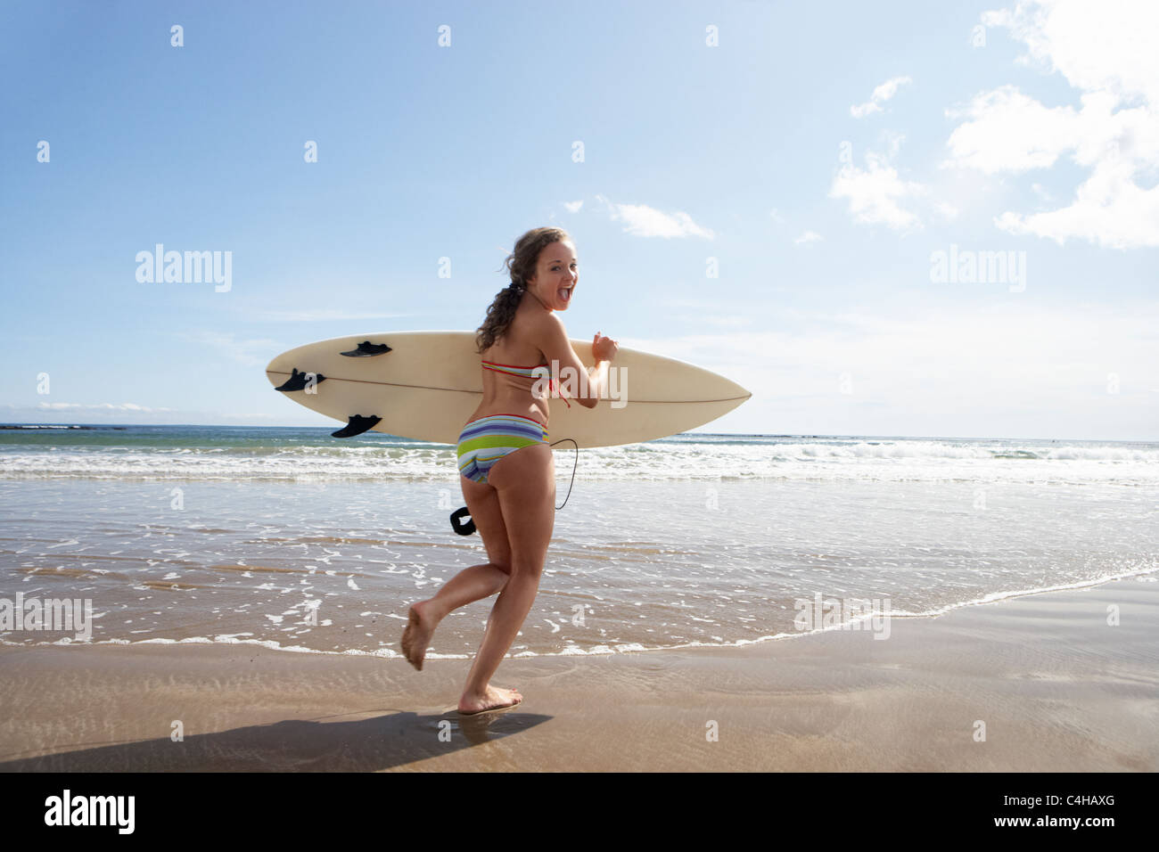 Teenager girl with surfboard Stock Photo