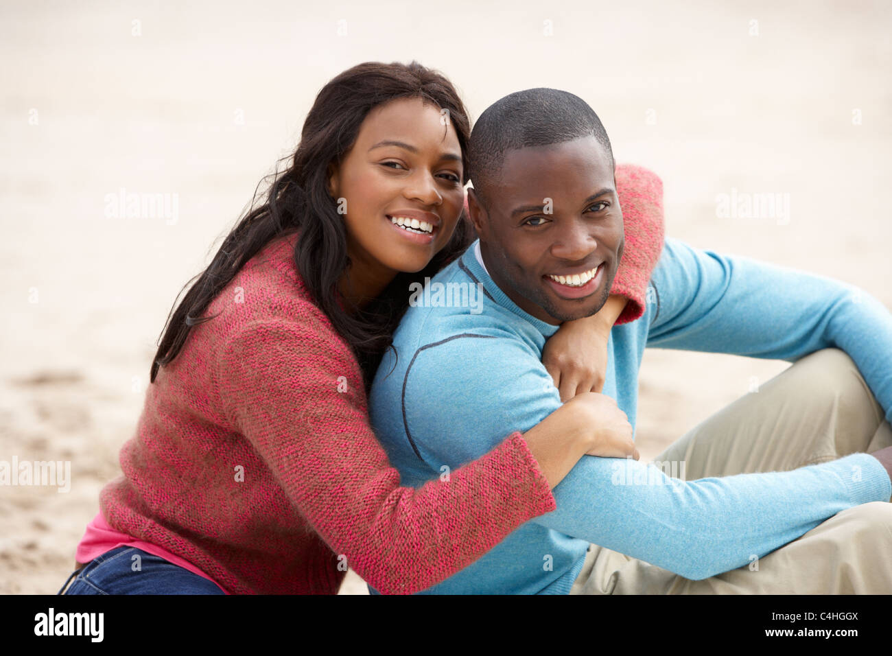Young couple Embracing on beach Stock Photo