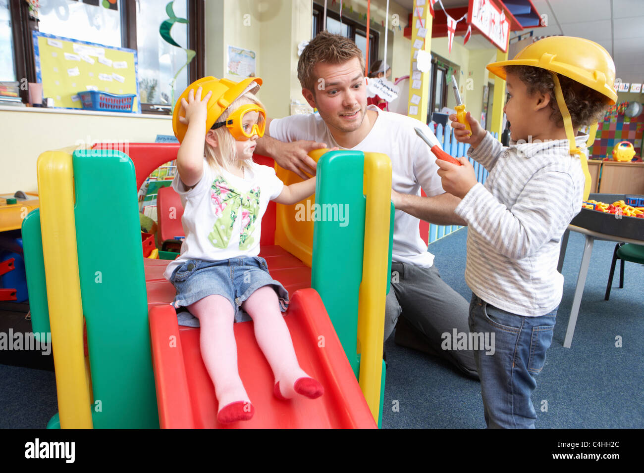 Man with children playing together Stock Photo