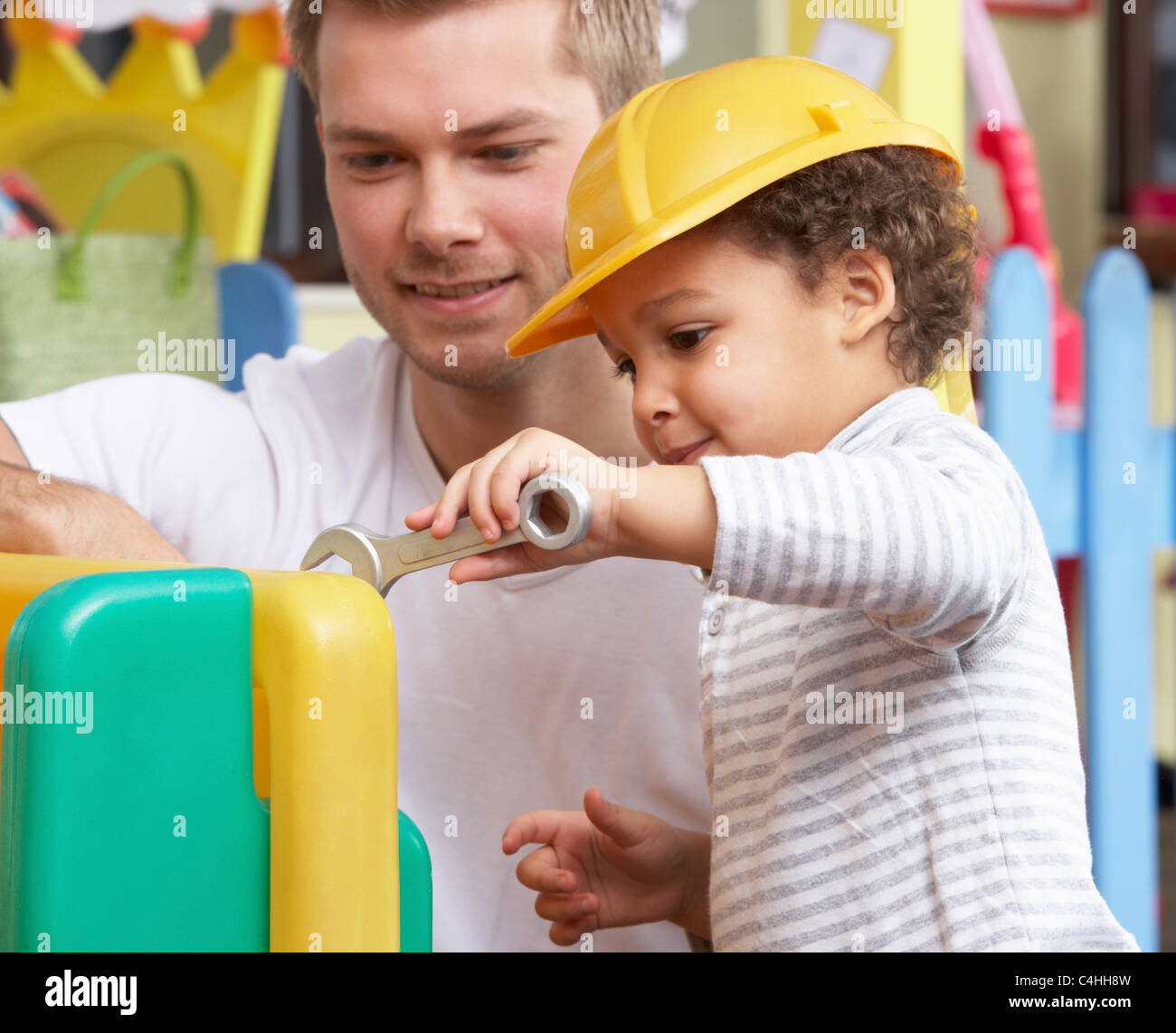 Man with children playing together Stock Photo