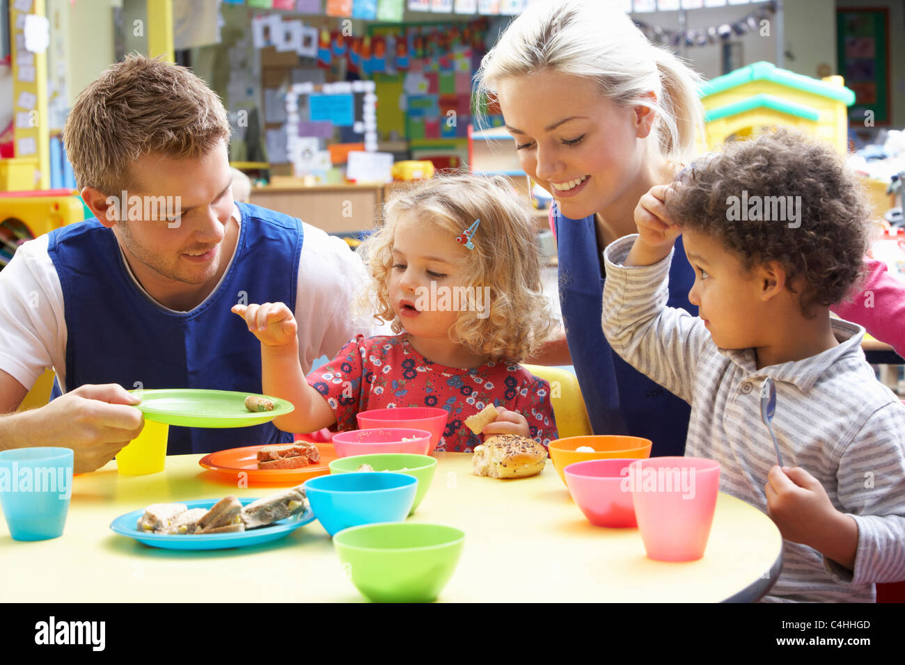 Couple and children playing with toys Stock Photo