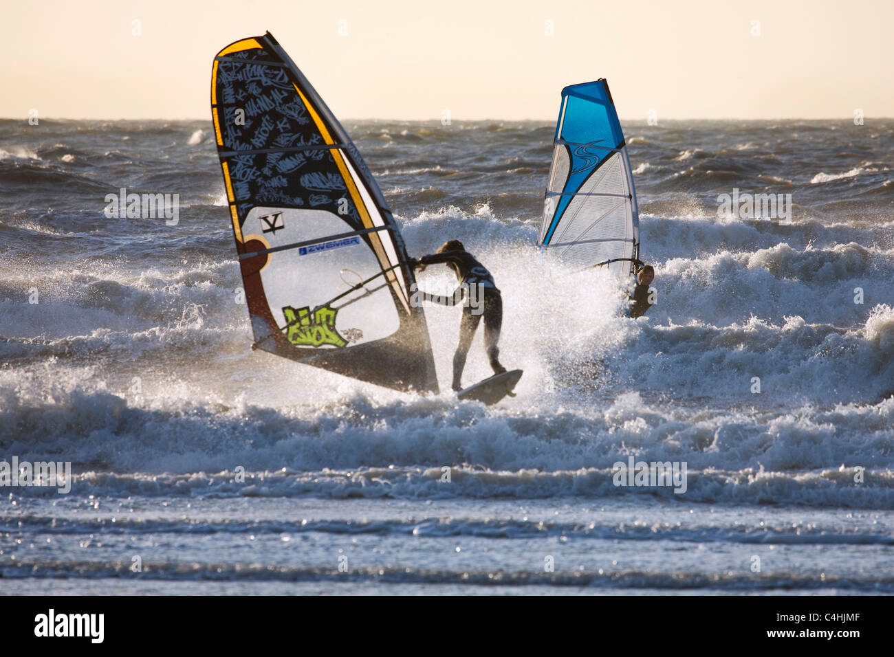 Two windsurfers windsurfing on the North Sea Stock Photo Alamy