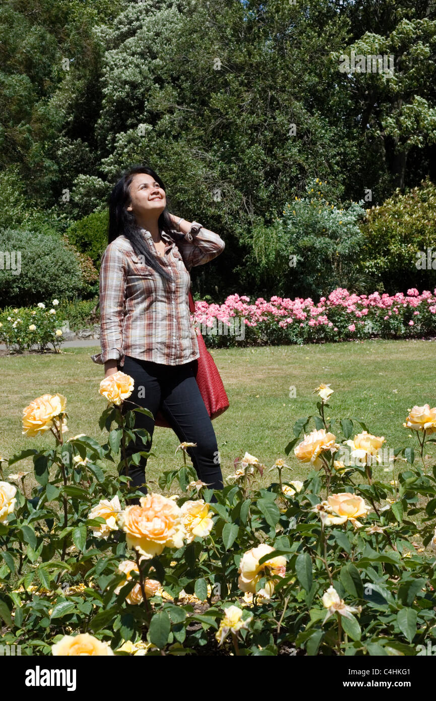 Woman walking in public park hi-res stock photography and images - Alamy