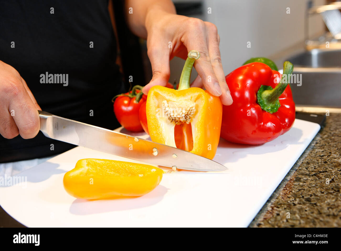 chopping bell peppers Stock Photo Alamy