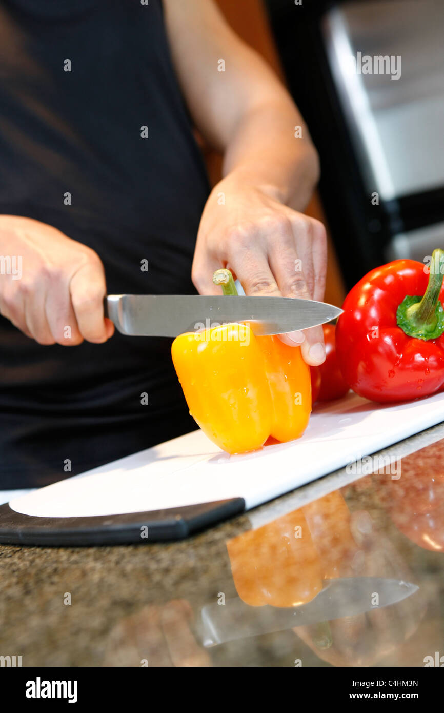 chopping bell peppers Stock Photo - Alamy