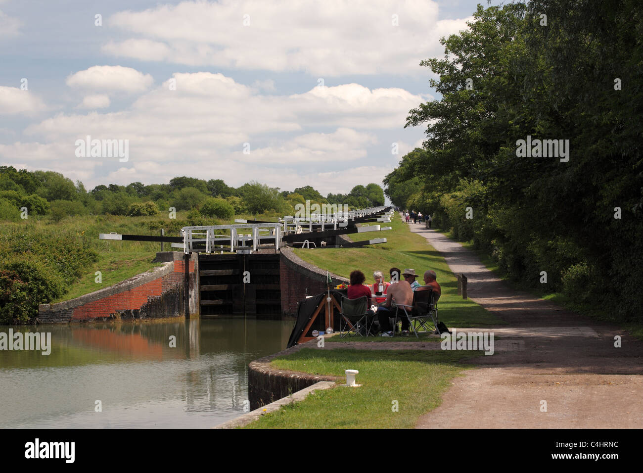 Family enjoying a picnic at Caen Hill locks, Kennet and Avon canal, Wiltshire, England, UK Stock Photo
