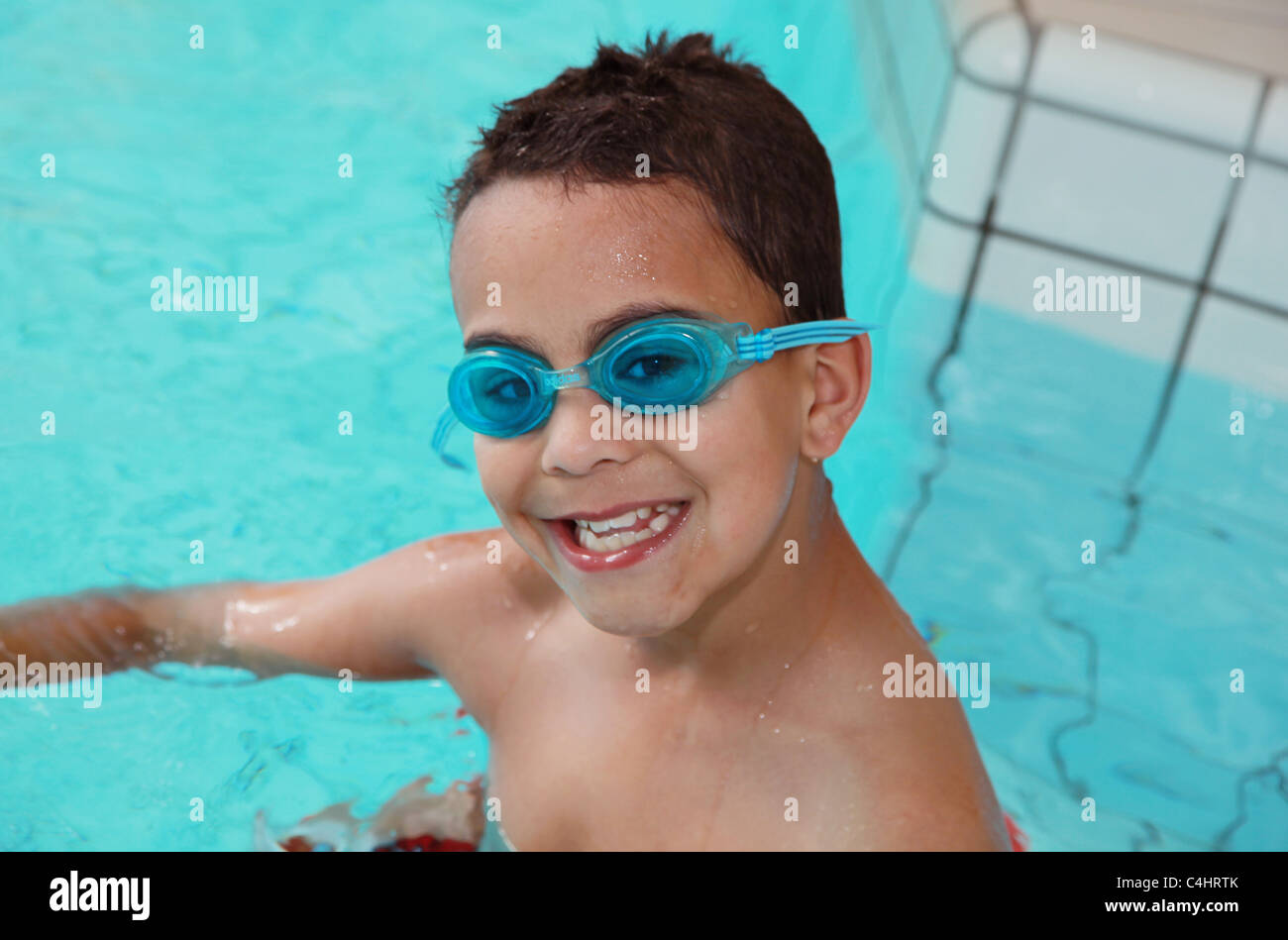 Young boy swimming with goggles Stock Photo Alamy