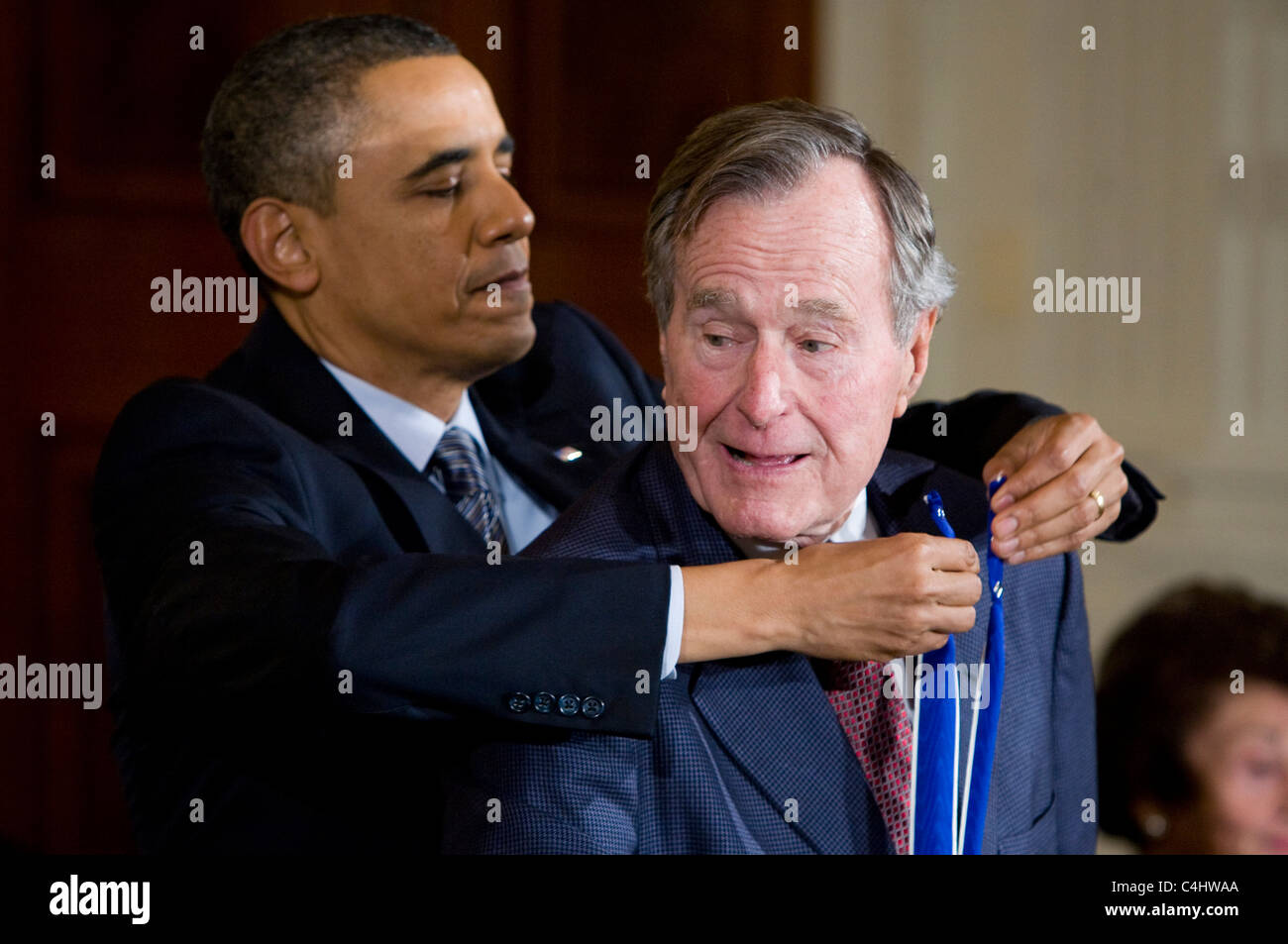 President Barack Obama presents the Presidential Medal of Freedom to former President George H.W. Bush. Stock Photo