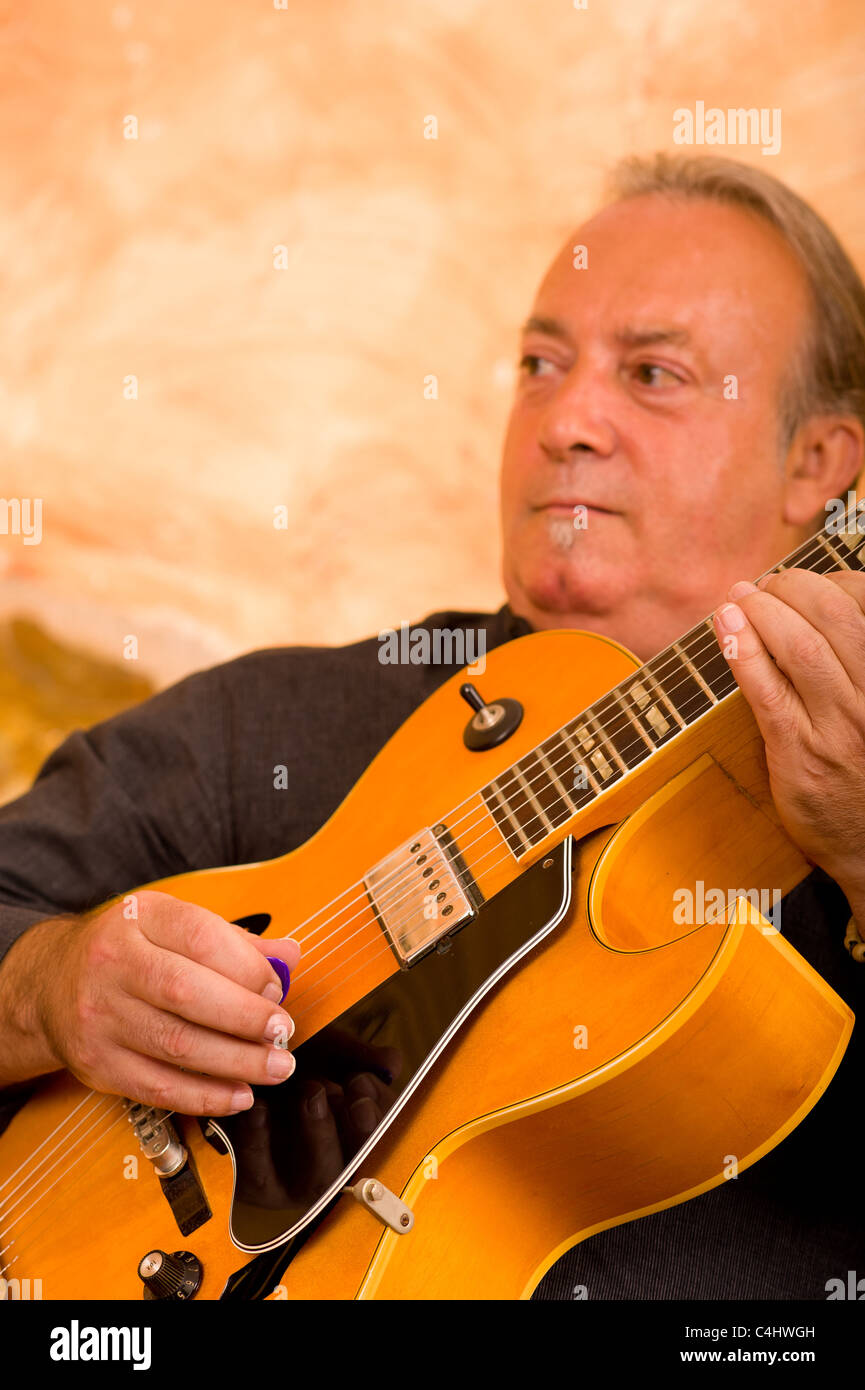 Jazz guitarist in action playing on stage Stock Photo Alamy