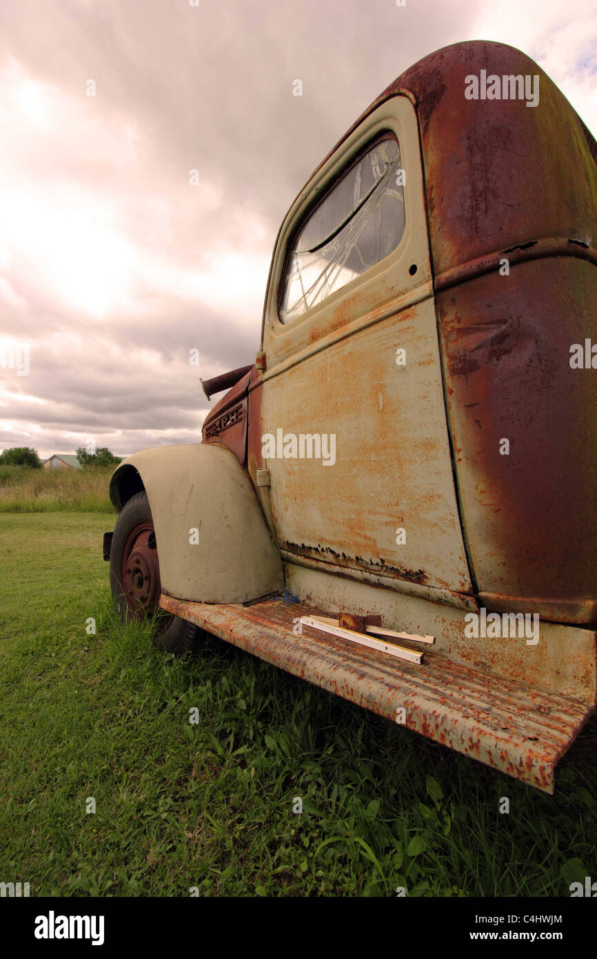 RUSTY OLD TRUCK IN A FIELD BDB Stock Photo