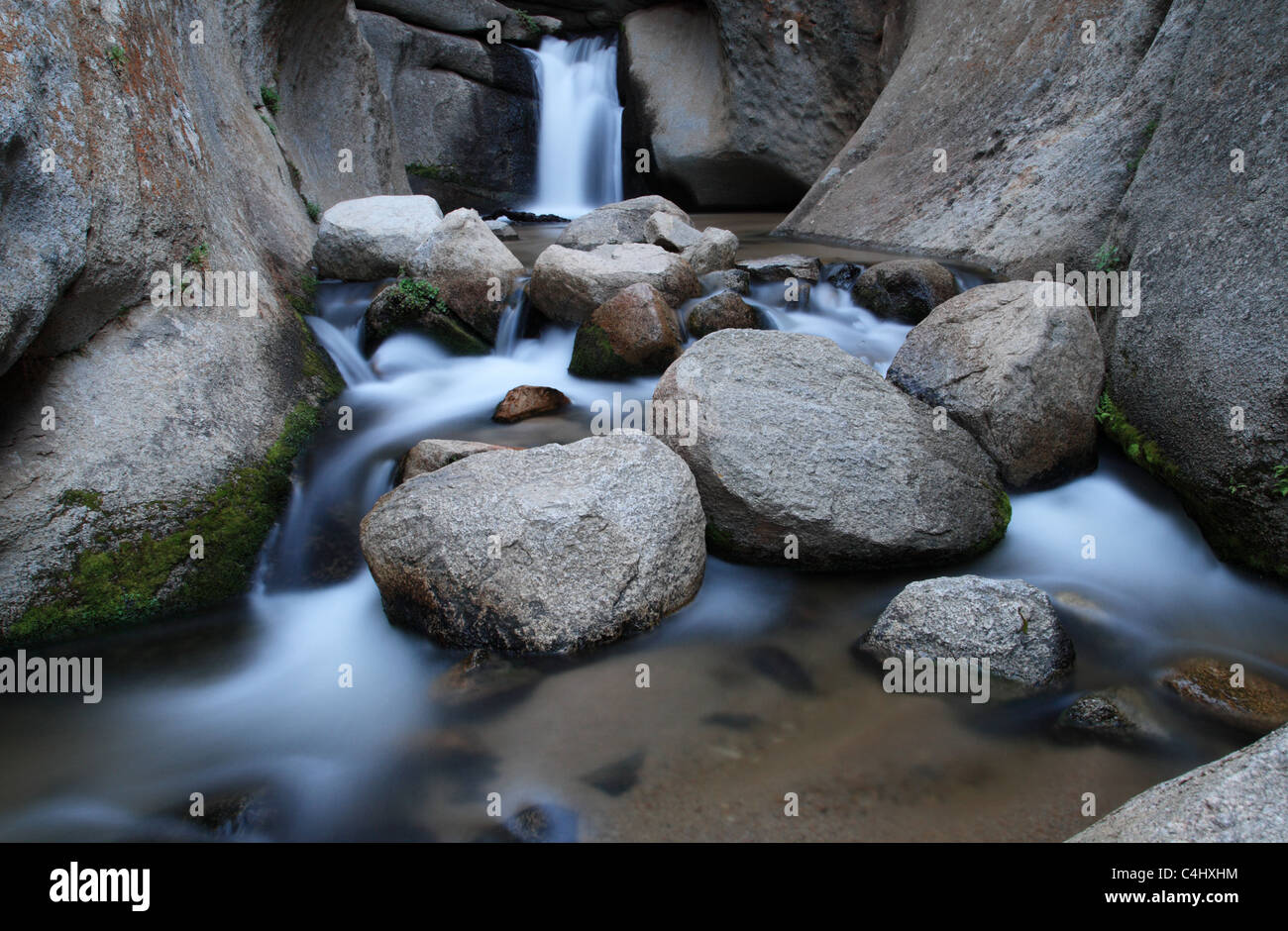 silky smooth waterfall in the carved granite canyon of McGee Creek Stock Photo