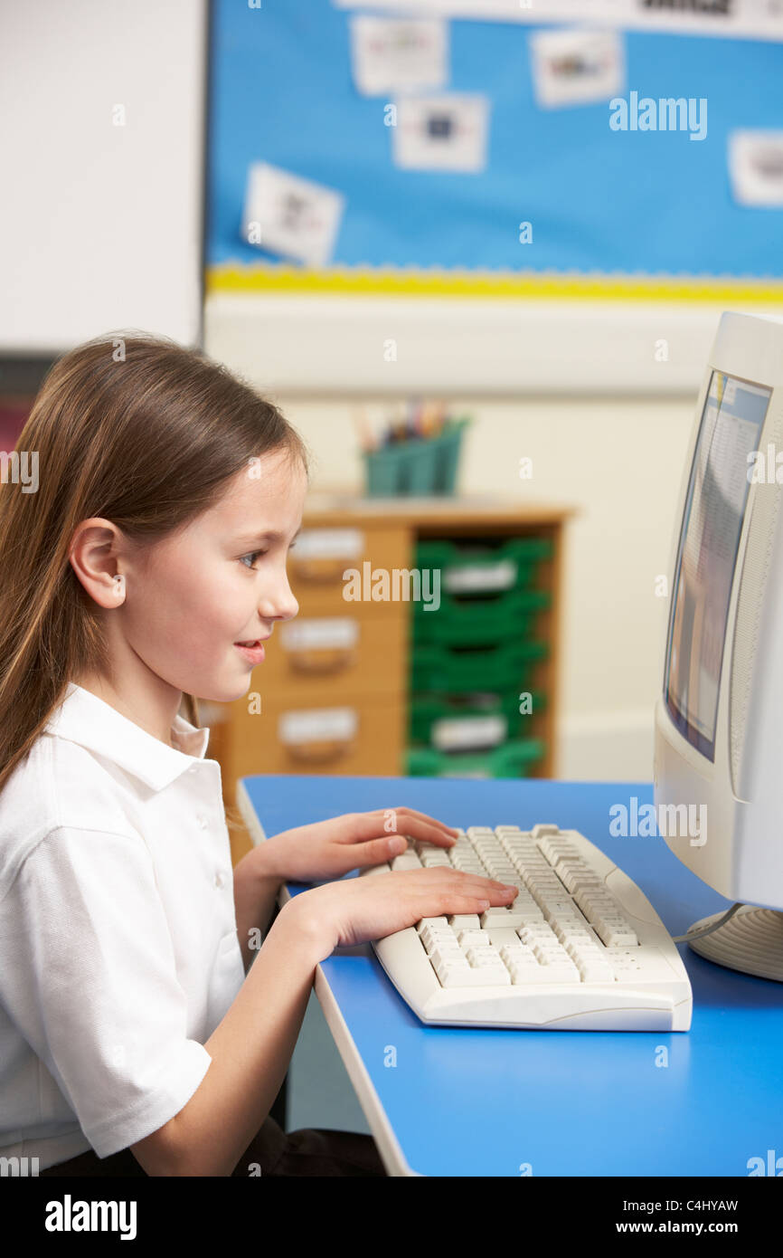 Schoolgirl In IT Class Using Computer Stock Photo - Alamy