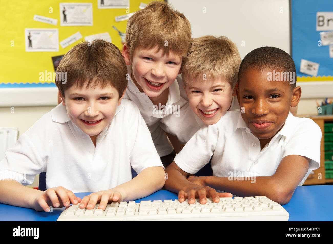 Schoolchildren in IT Class Using Computers Stock Photo