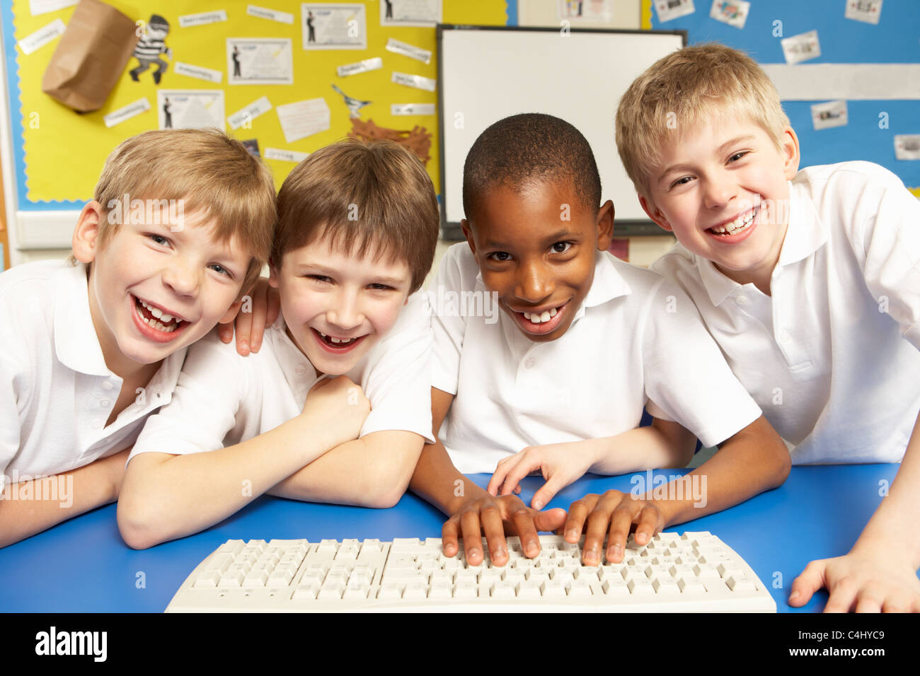 Schoolchildren in IT Class Using Computers Stock Photo