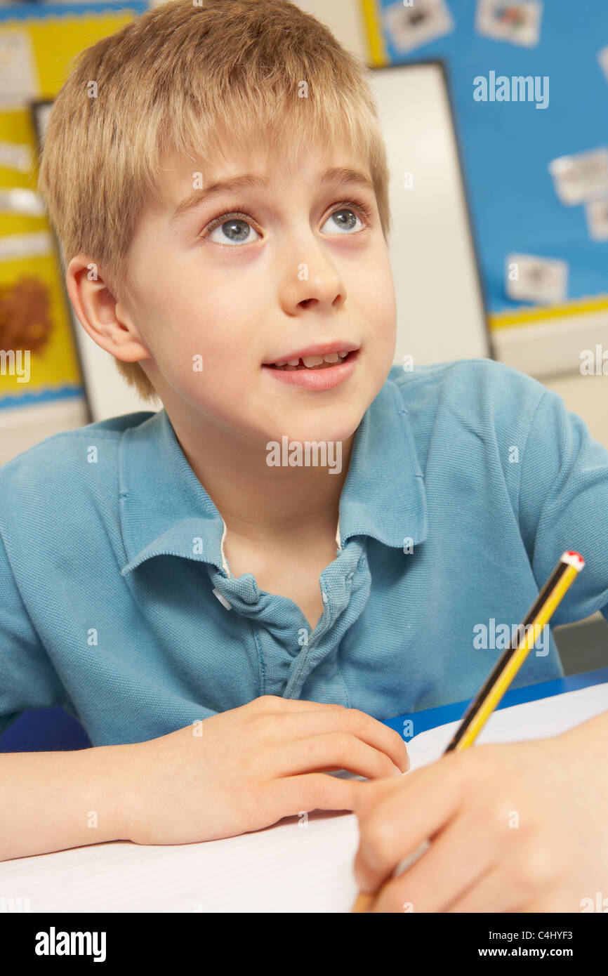 Schoolboy Studying In Classroom Stock Photo Alamy