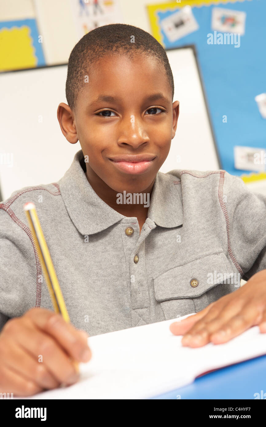 Schoolboy Studying In Classroom Stock Photo Alamy