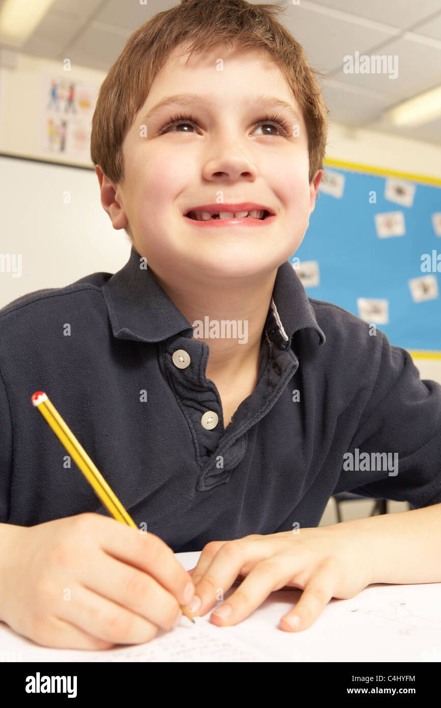 Schoolboy Studying In Classroom Stock Photo Alamy