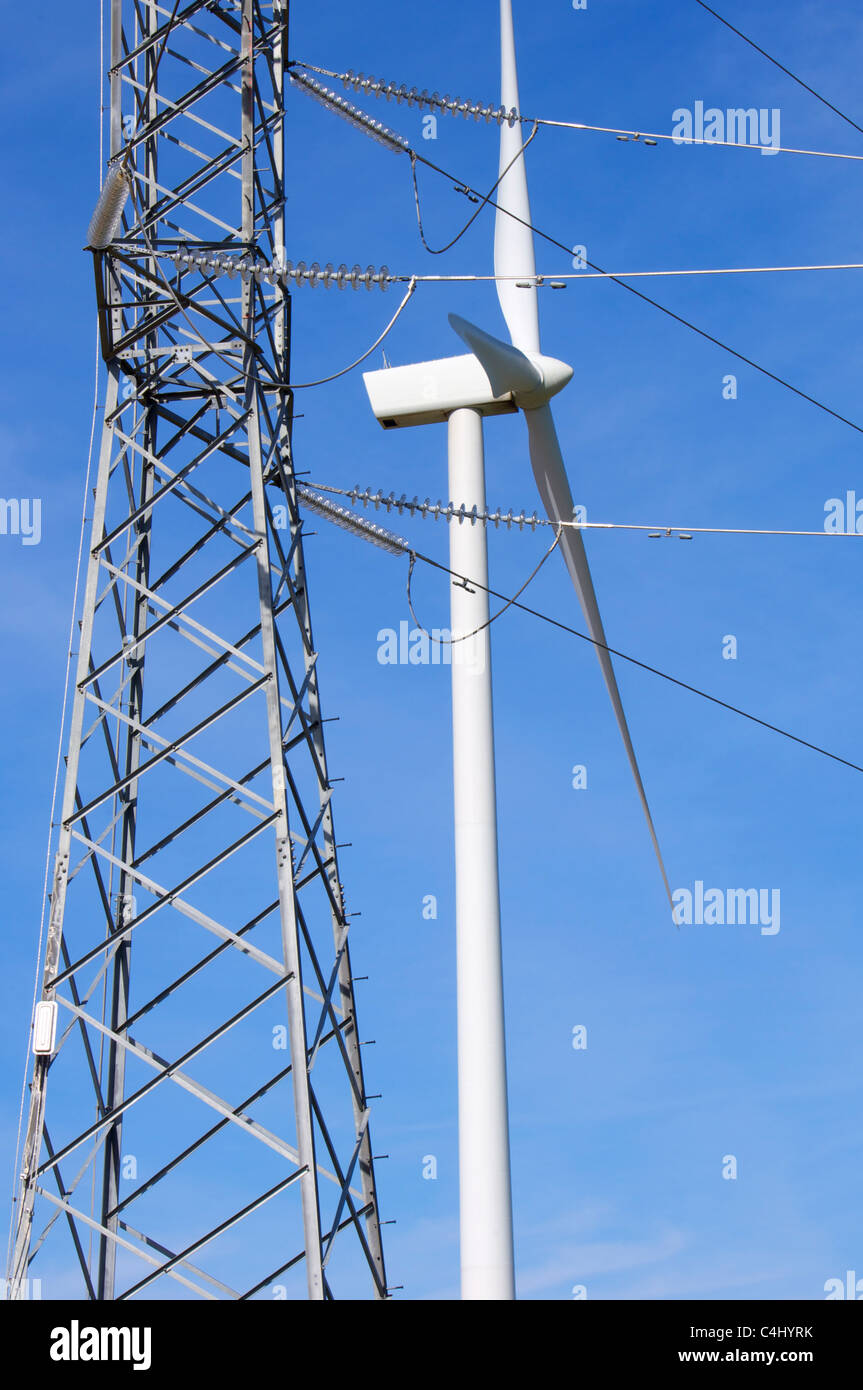 windmill and power line with blue and clear sky Stock Photo - Alamy