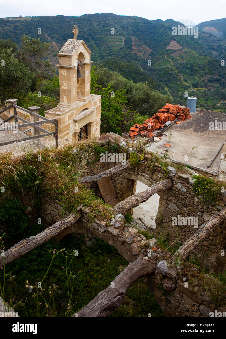 Polyrinia Church tower and ruined rooof in the ancient Hellenic city of Polyrinia ...