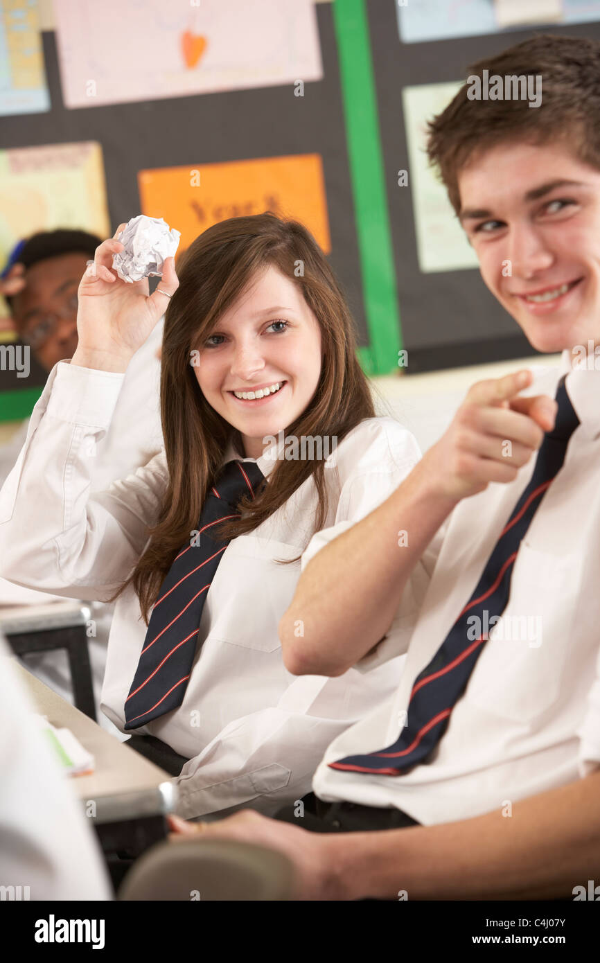 Teenage Students Misbehaving In Classroom Stock Photo