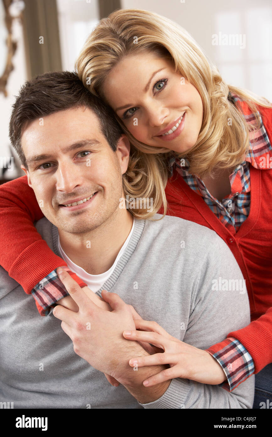Portrait Of Happy Young Couple At Home Stock Photo - Alamy