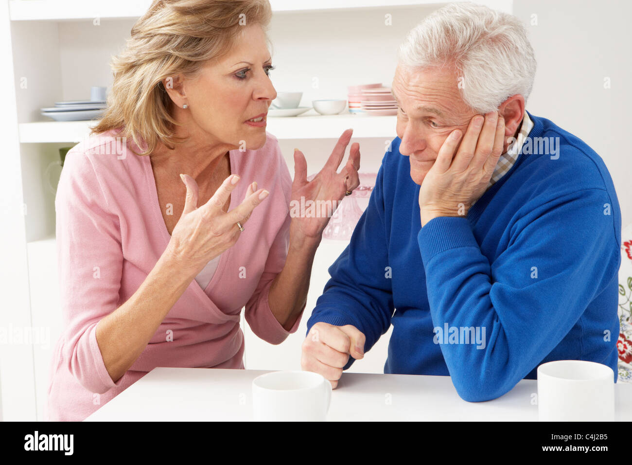 Senior Couple Having Argument At Home Stock Photo