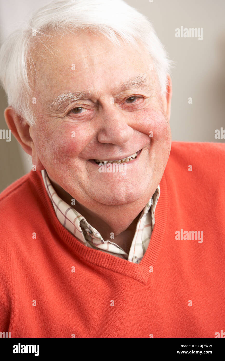 Senior Man Relaxing In Chair At Home Stock Photo - Alamy