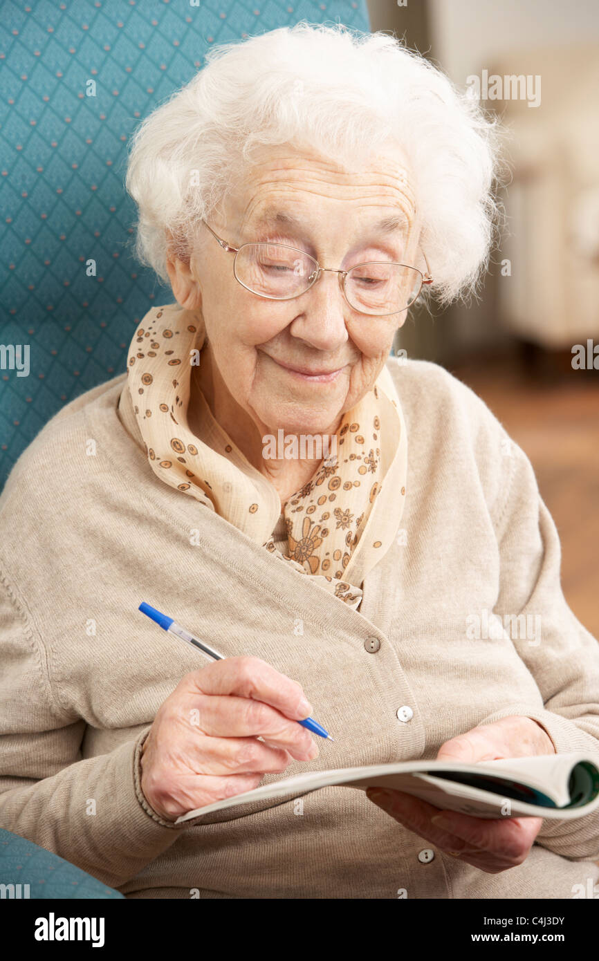 Completing crossword puzzle hires stock photography and images Alamy