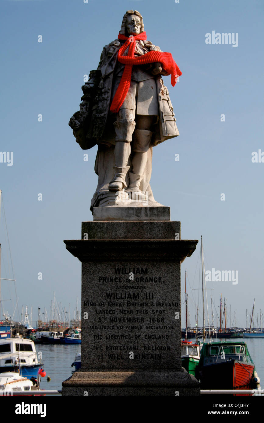 Statue of William of Orange , Brixham harbour , Devon. Decorated with an orange scarf Stock Photo