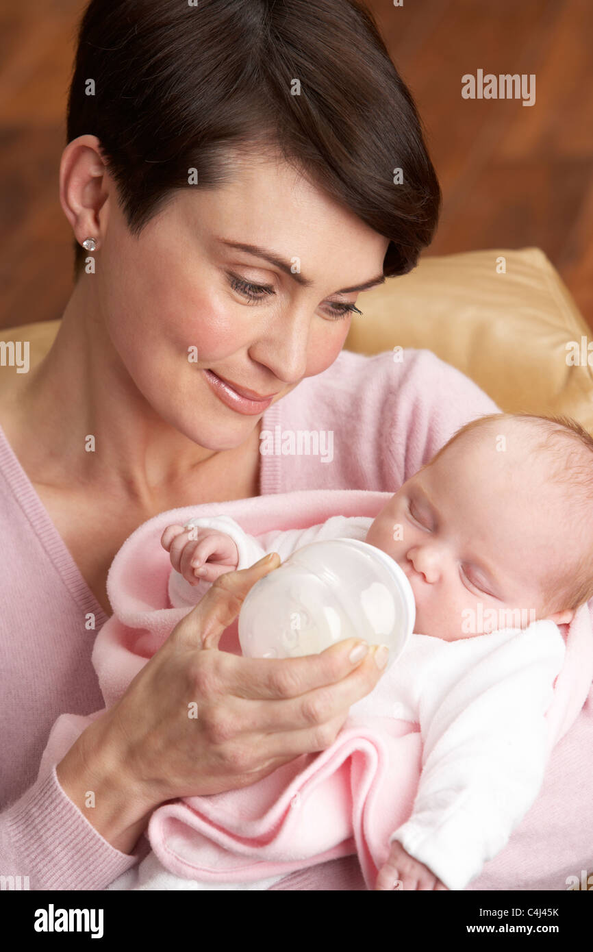 Portrait Of Mother Feeding Newborn Baby At Home Stock Photo Alamy