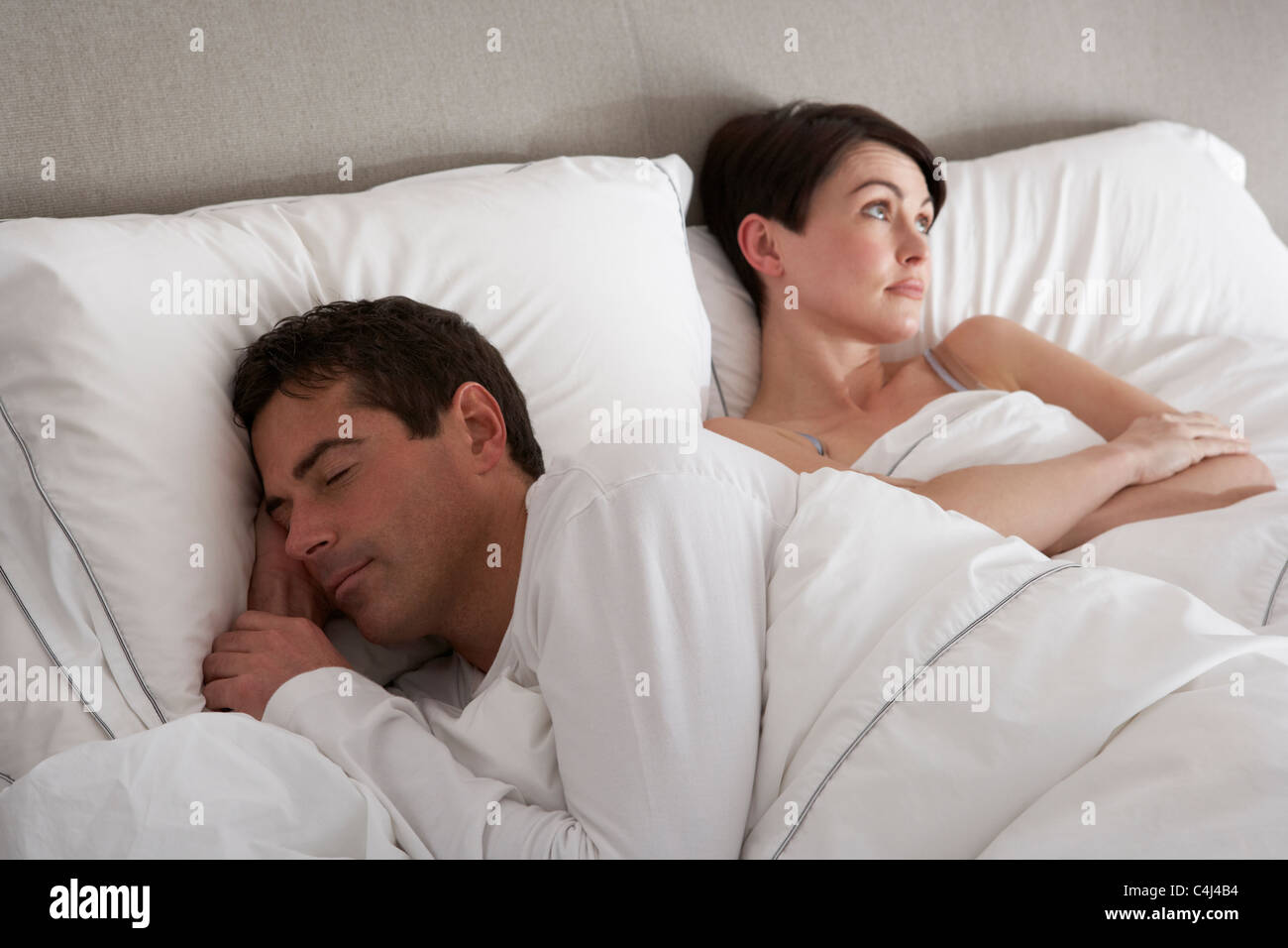 Couple With Problems Having Disagreement In Bed Stock Photo
