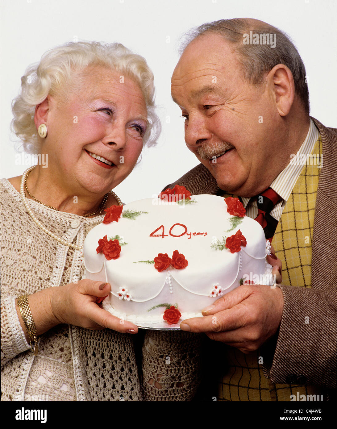  Old  couple pensioners with 40th Ruby wedding  