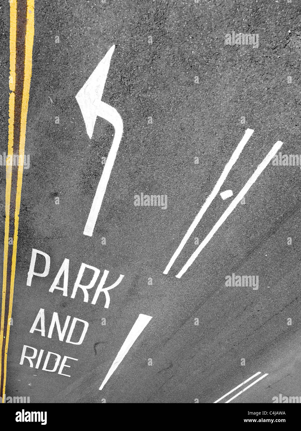 Park and Ride road marking and arrow with double yellow lines viewed from above Stock Photo