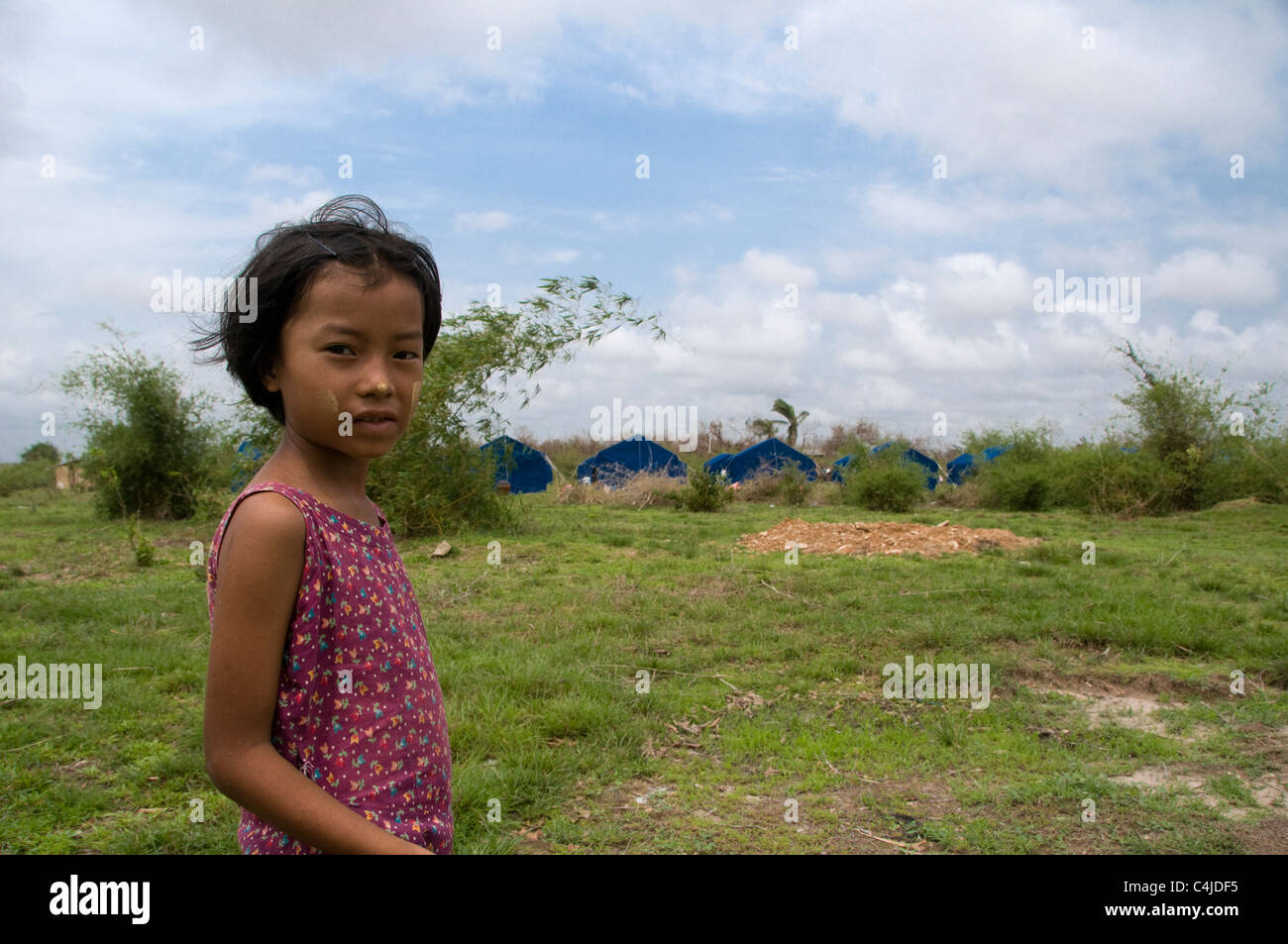 Young girl in a relief encampment set up by the government for cyclone Nargis victims in Kyauktan township of Yangon Myanmar Burma Stock Photo