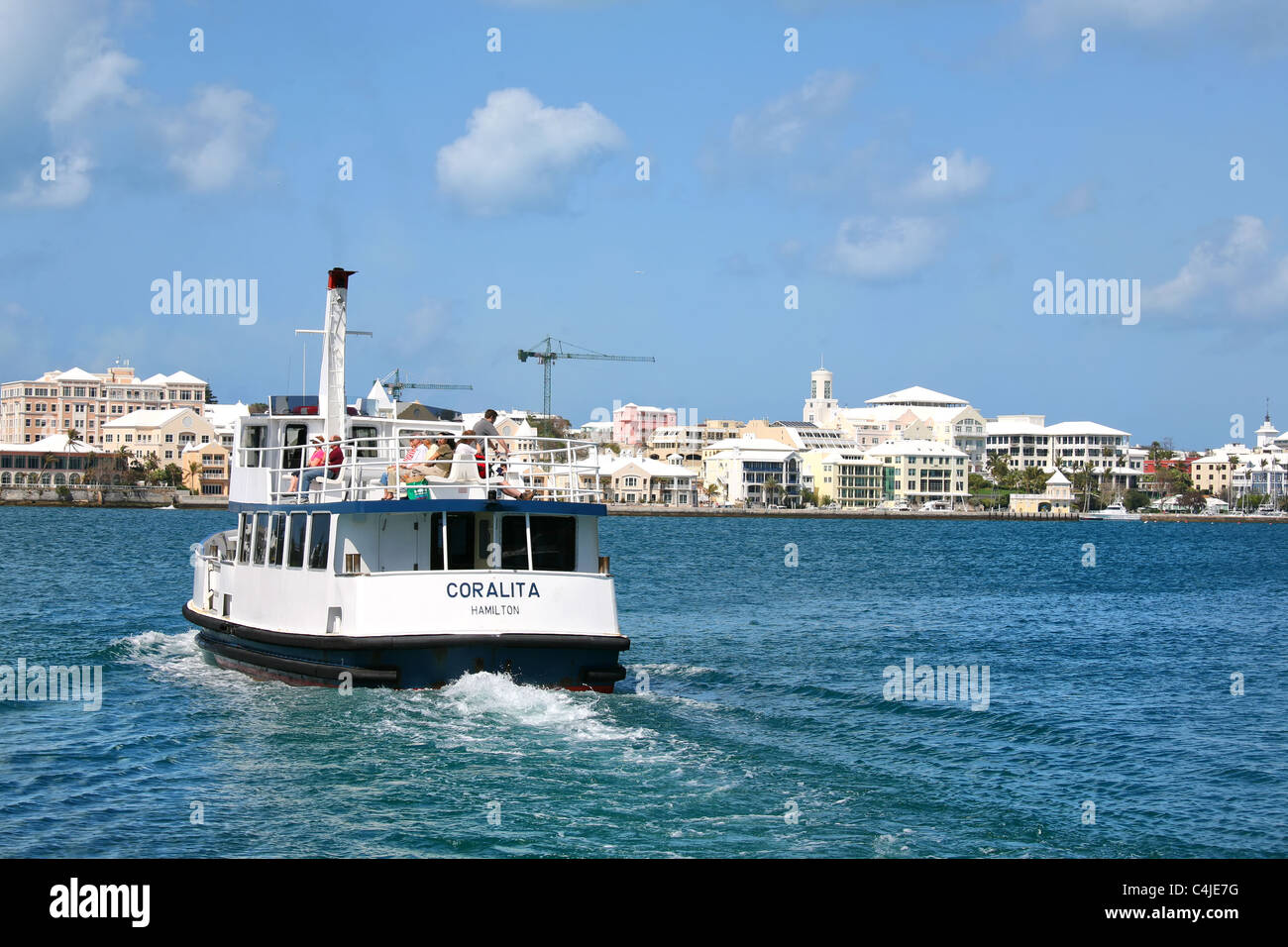 Small passenger ferry leaving the community of Salt Kettle, heading towards the city of Hamilton, Bermuda Stock Photo