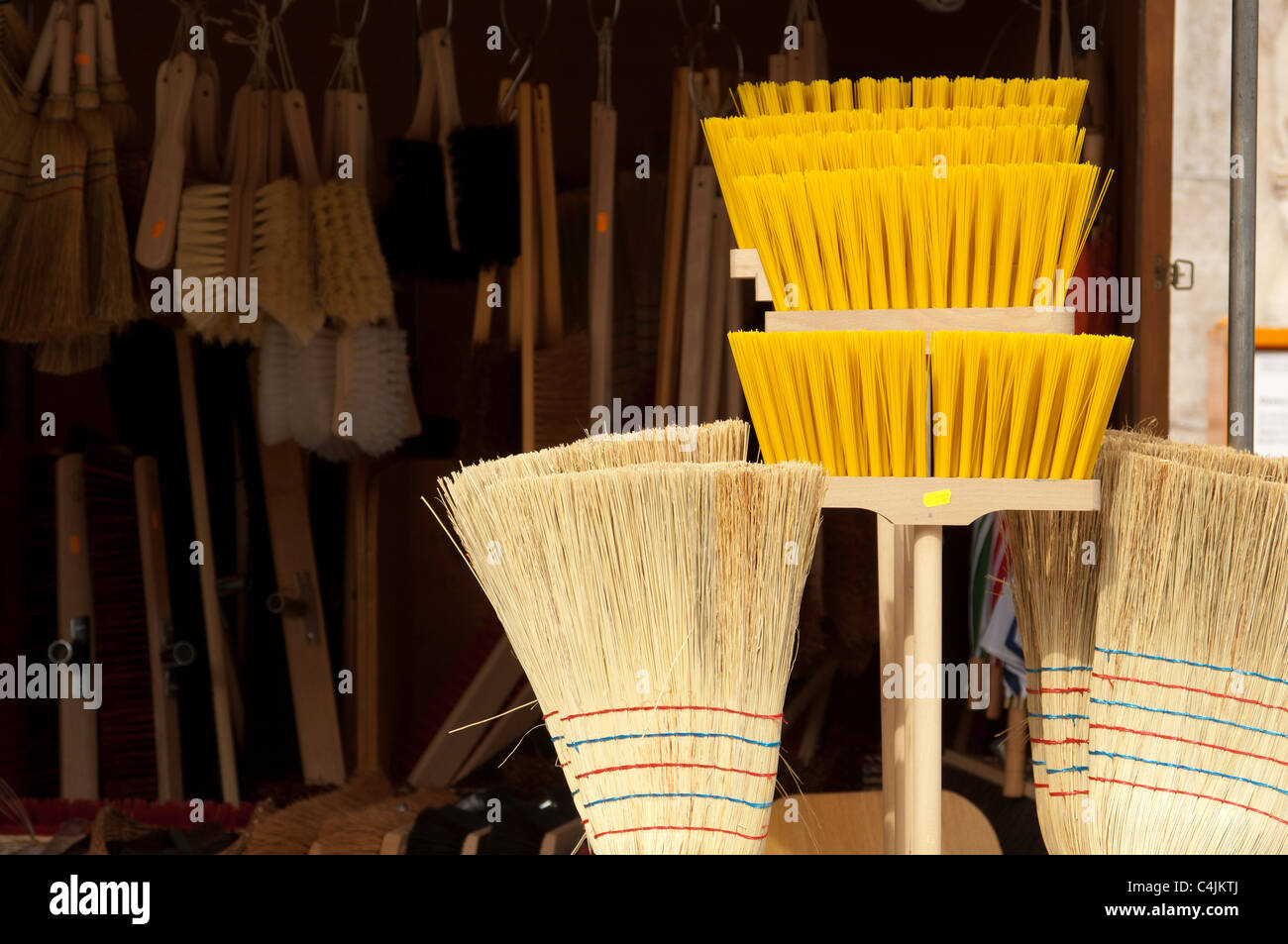 Brooms, brushes and cleaning equipment for sale on a market stall in