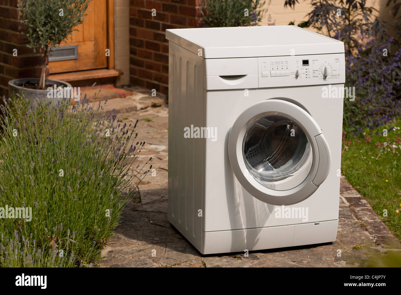 Washing machine delivered outside the house Stock Photo