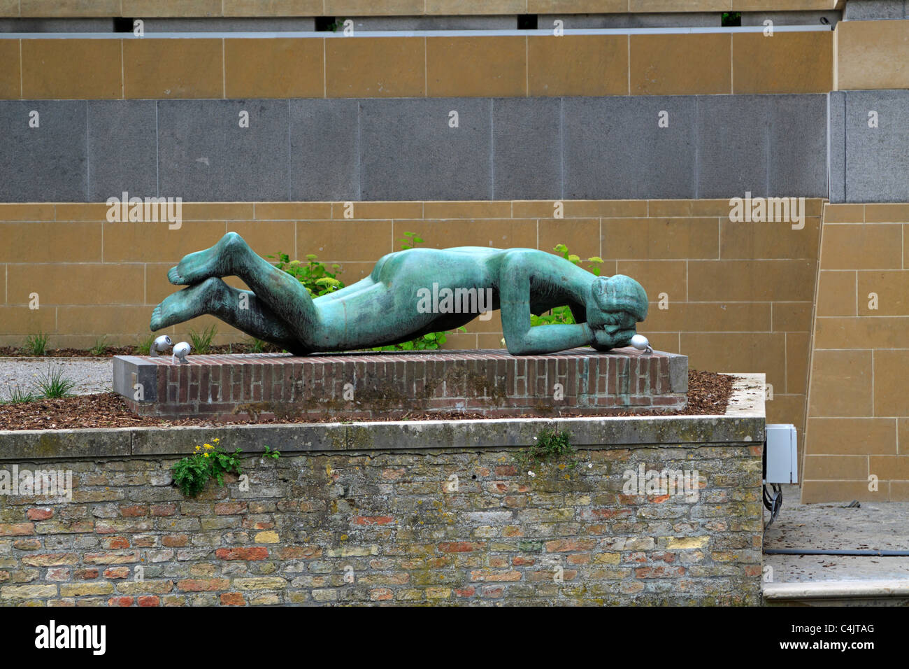Statue beside the Steenhouwersdijk canal in Bruges, Belgium Stock Photo