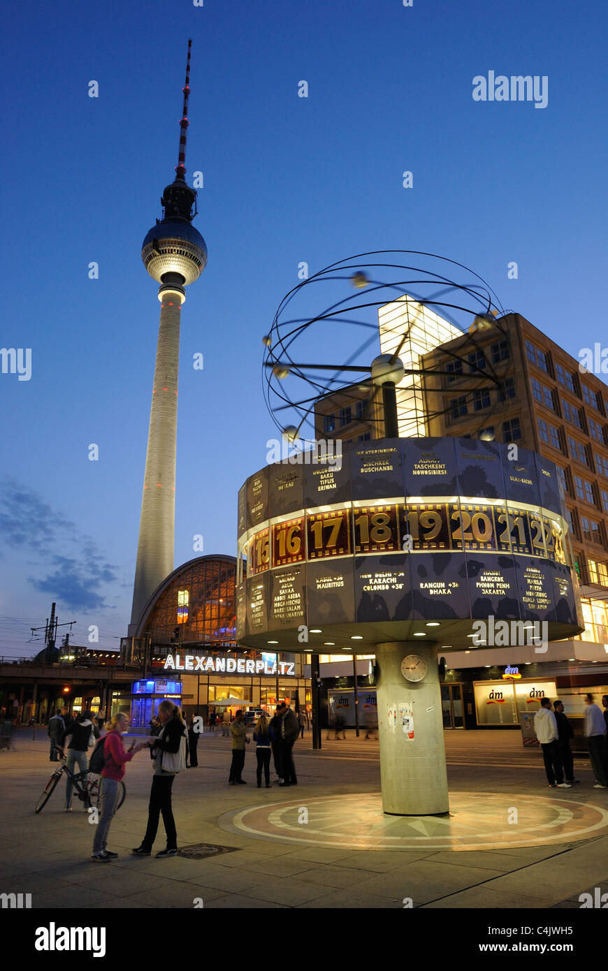 Alexanderplatz square with world clock, Alexanderplatz station and TV tower at dusk, Mitte district, Berlin, Germany, Europe Stock Photo
