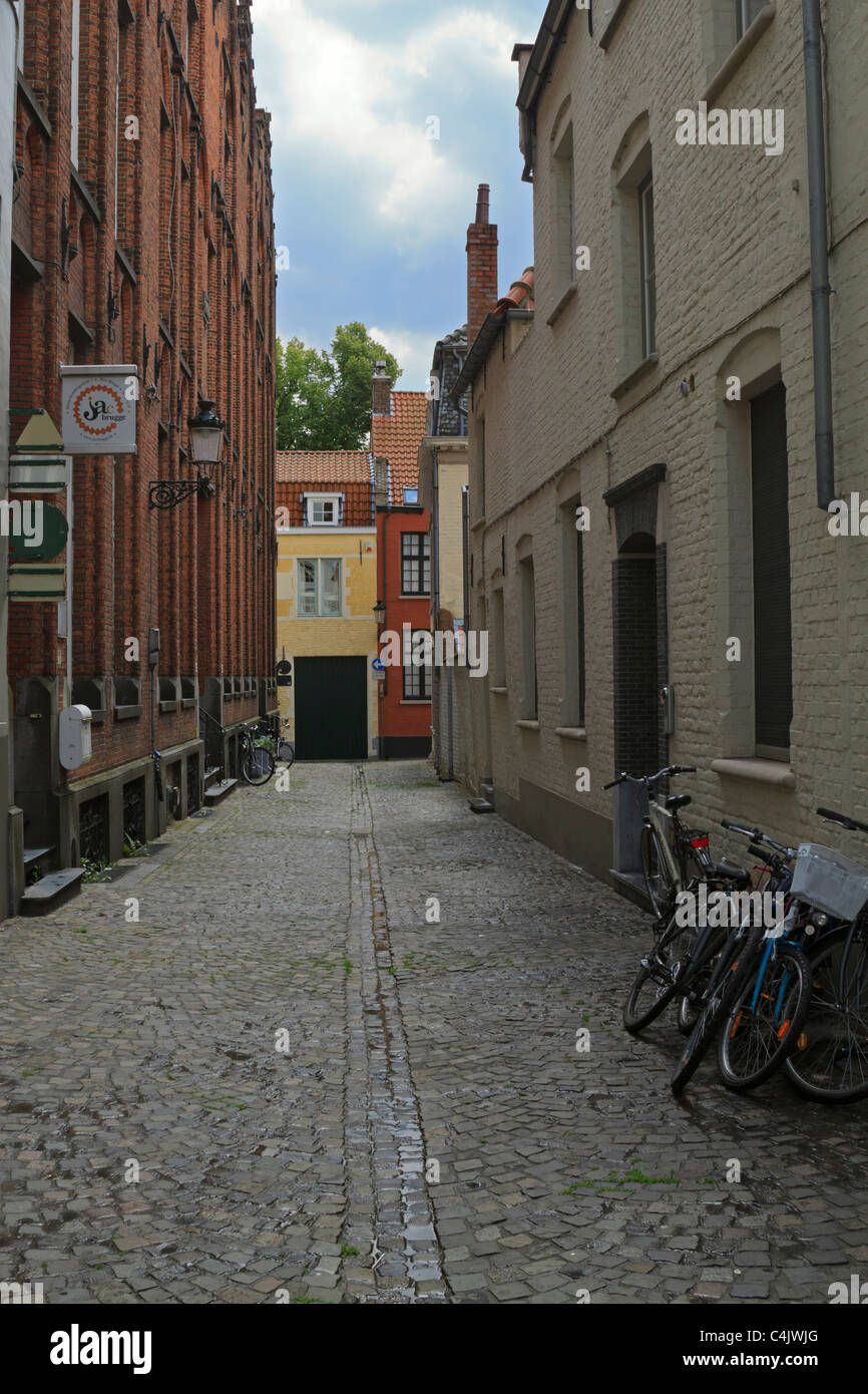 Narrow street in the historic centre of Bruges, Belgium. Stock Photo
