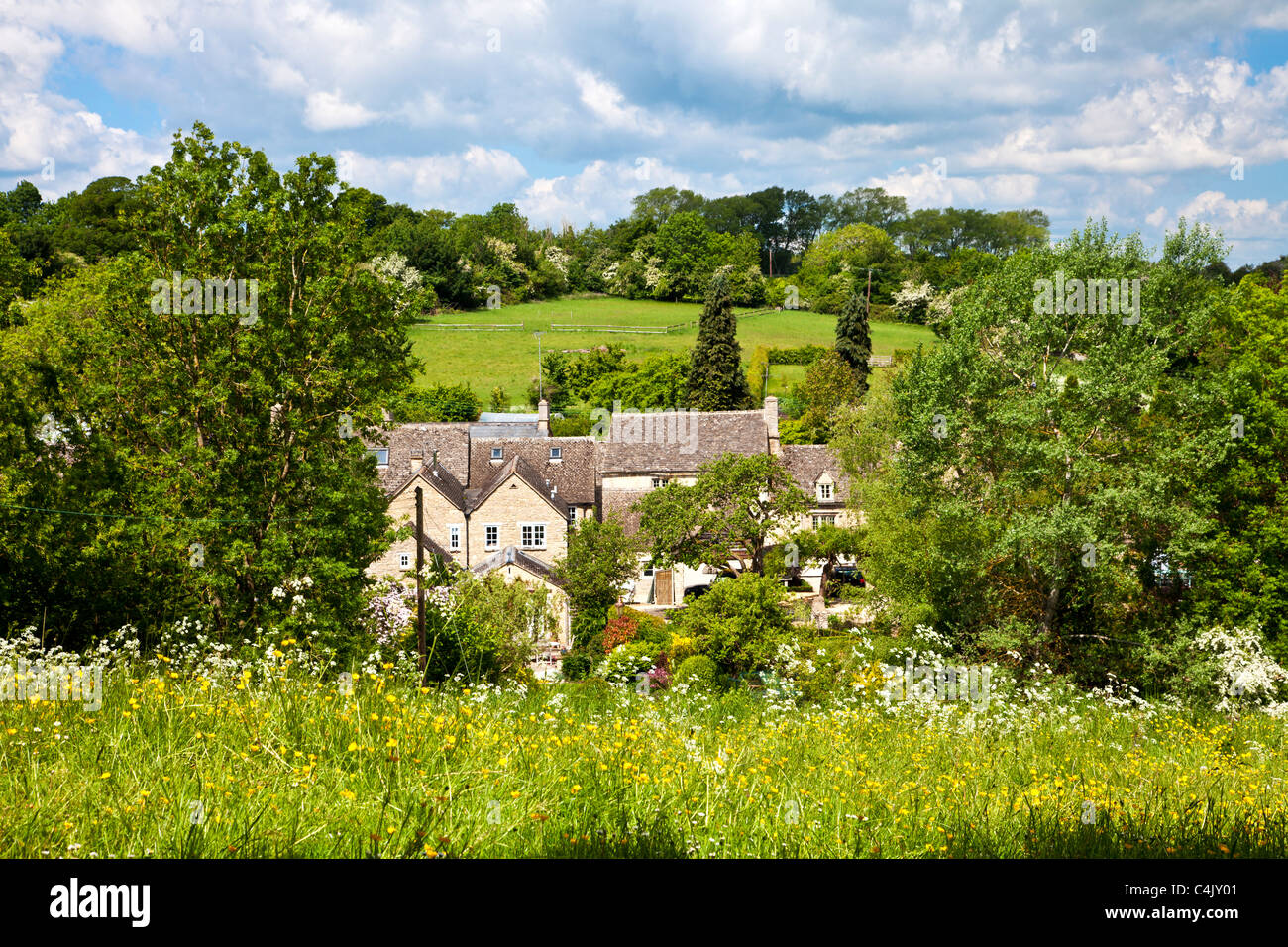 Houses and cottages in the pretty Cotswold village of Shilton, Oxfordshire, England, UK on a sunny day in spring Stock Photo