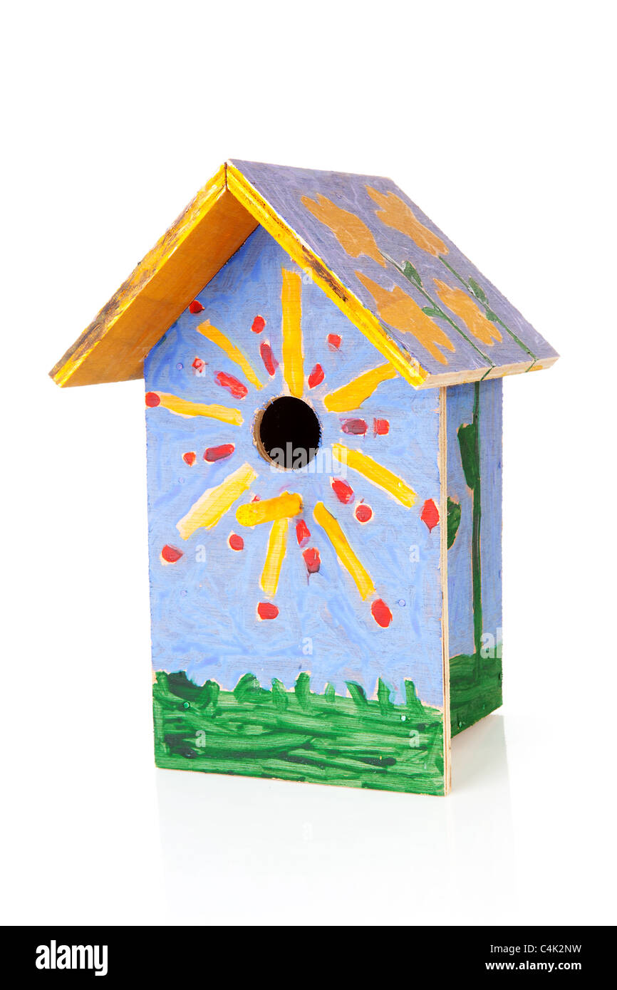 Colorful birdhouse painted by children over white background Stock Photo