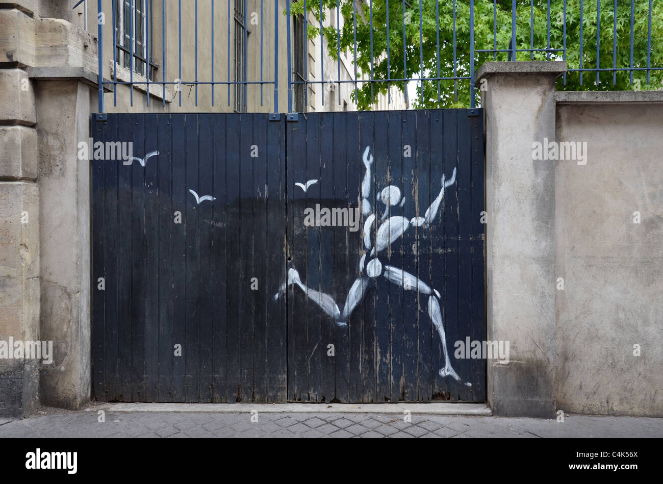 A piece of graffiti by Jérome Mesnager in the Rue Mouffetard, Paris France. Stock Photo