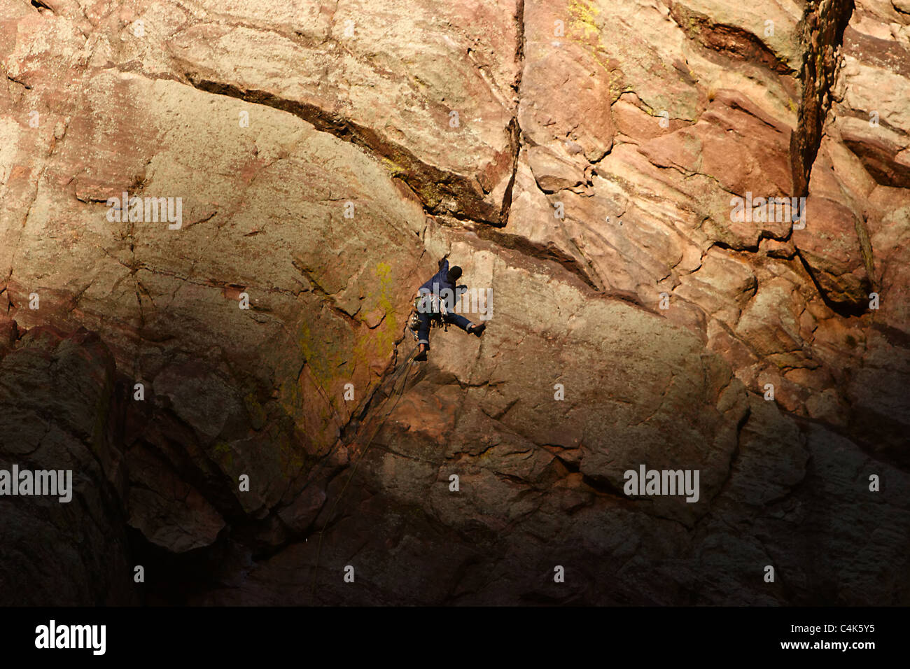 Eldorado Springs, Colorado A rock climber ascending a cliff from the