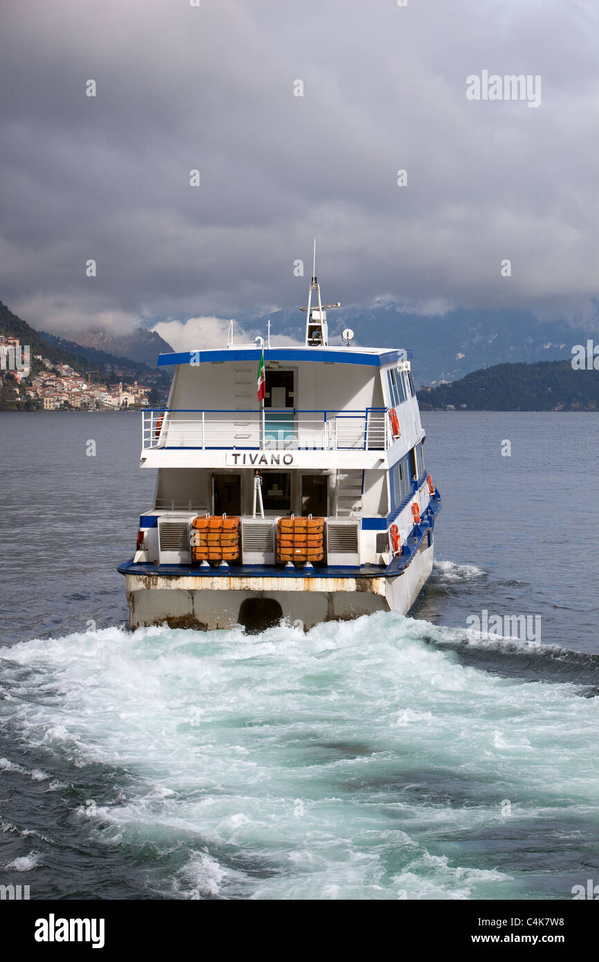 Ferry sailing Argegno Lake Como into rainy weather. Italy Stock Photo